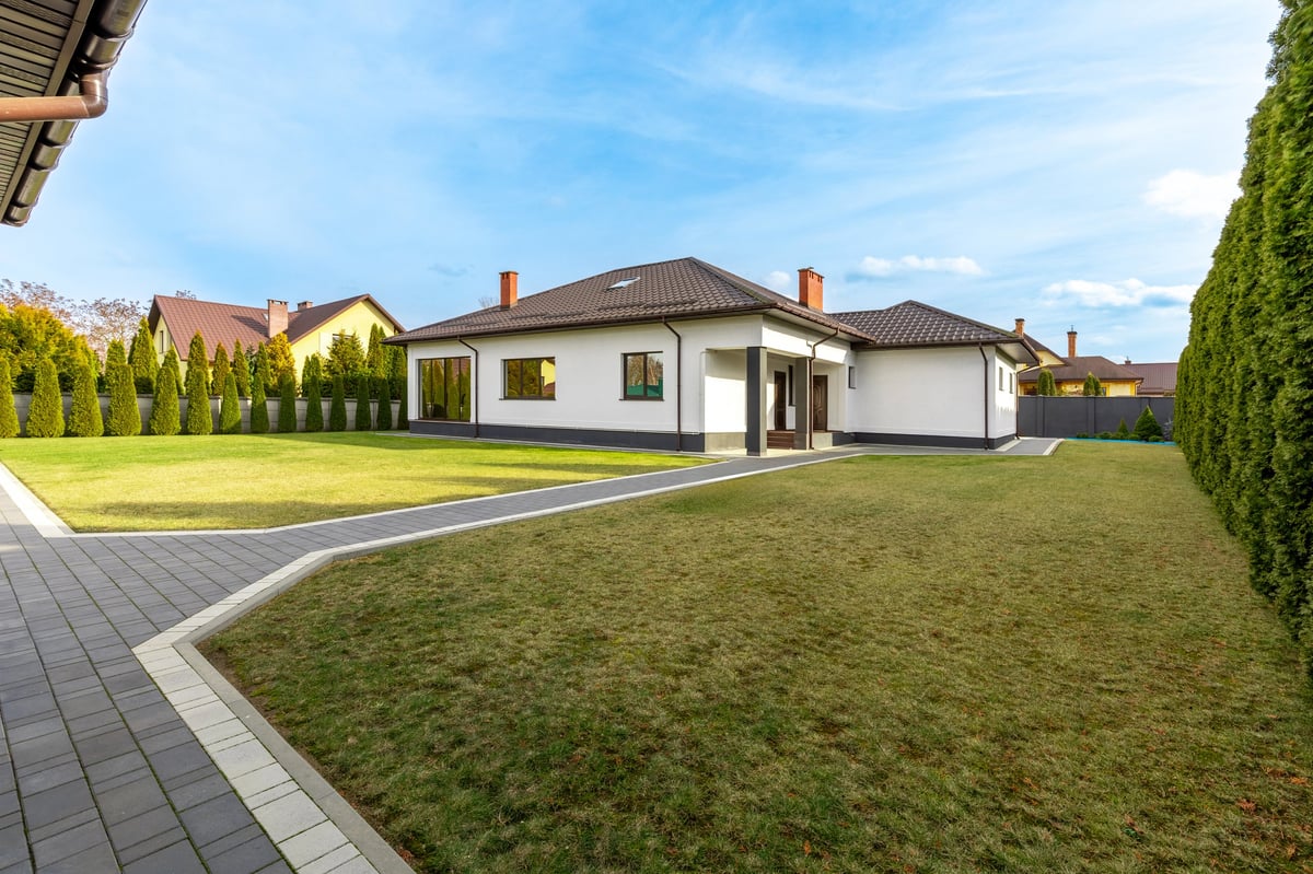 Premium campus-area home exterior — sell, refinance, or hold decision review