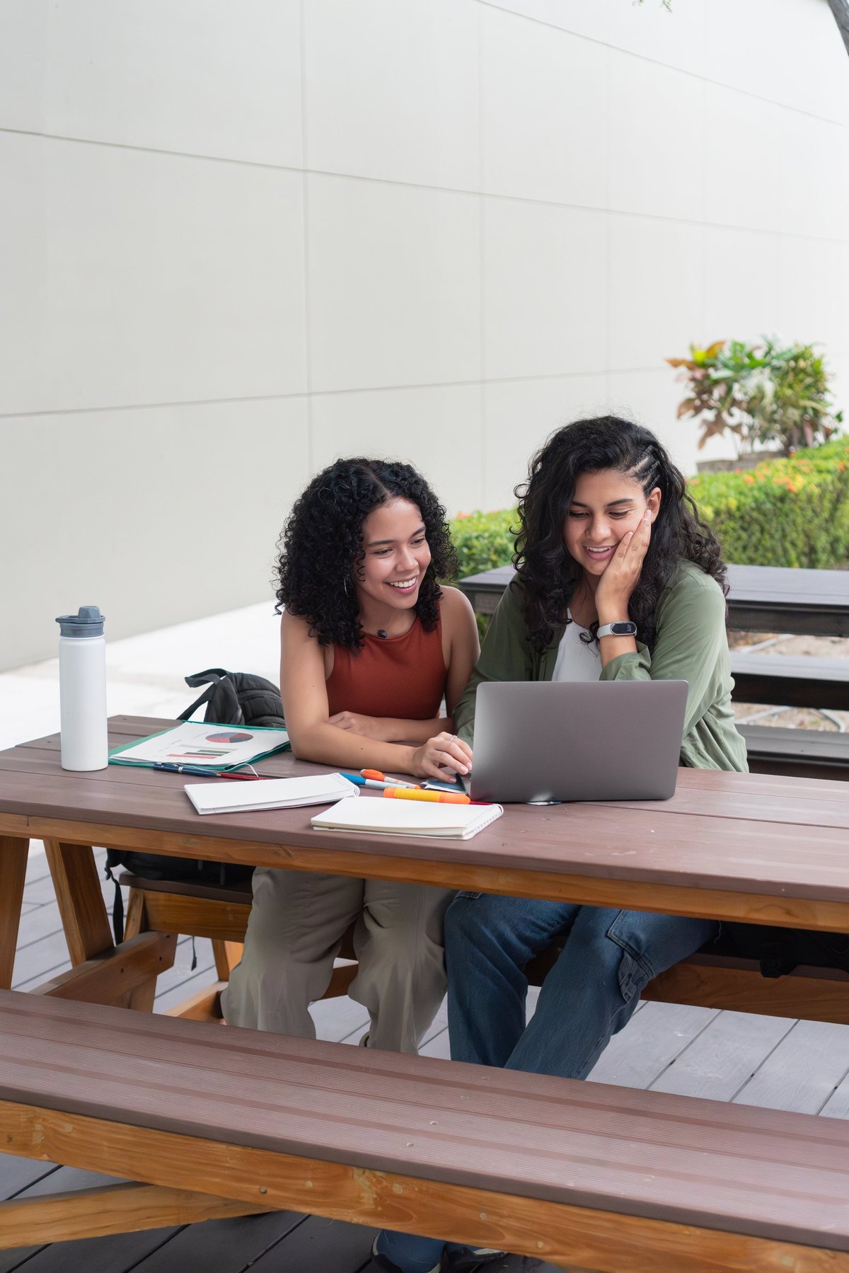 College roommates collaborating in a clean shared off-campus living space near Penn State University