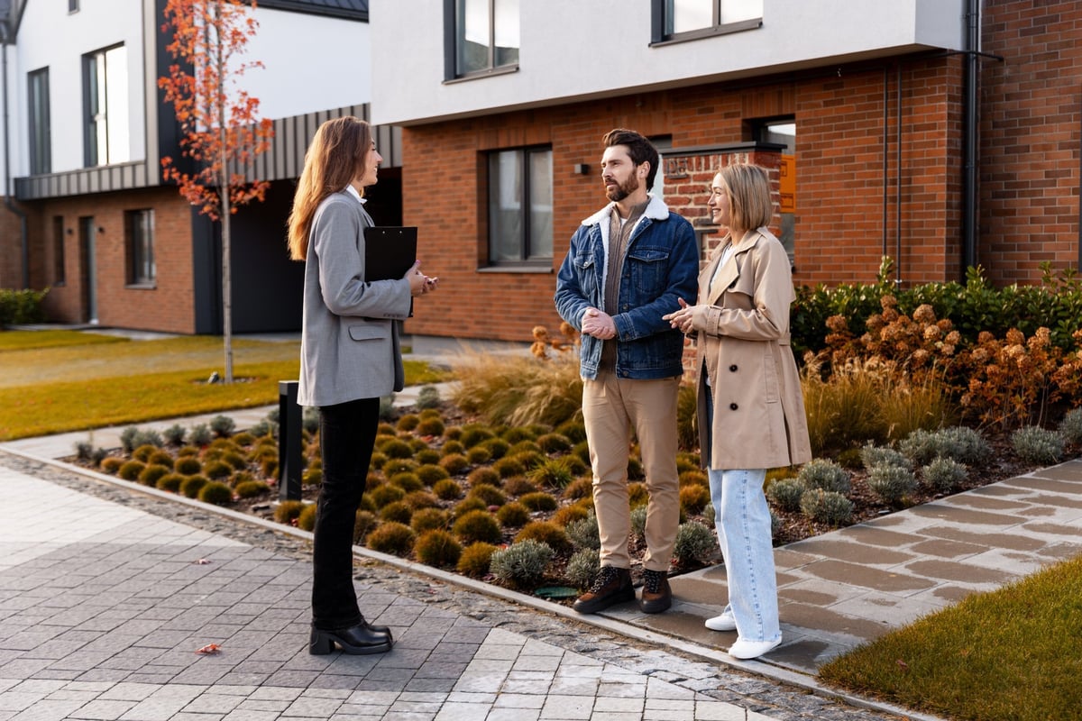 College housing real estate agent consulting with clients about campus-area property