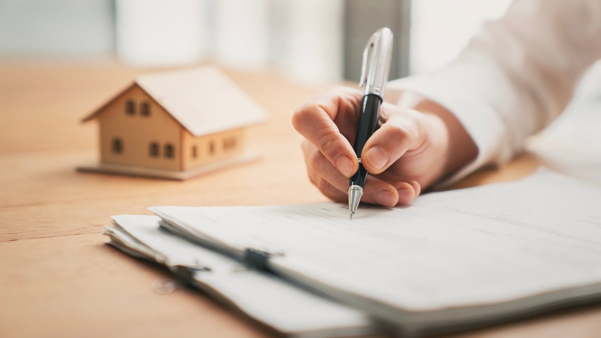 Loan officer reviewing financing options for a campus-area rental property
